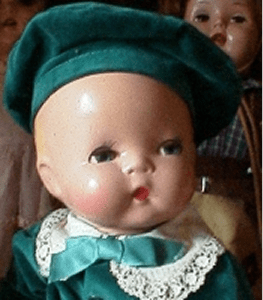 Collectible doll with lace collar