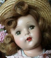 Doll wearing a straw hat