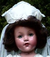 Vintage doll with a white veil
