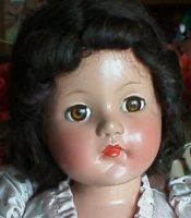 Classic doll with red lips and curls