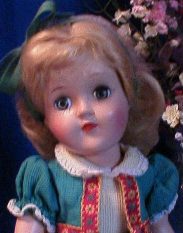 Vintage doll with a blue dress
