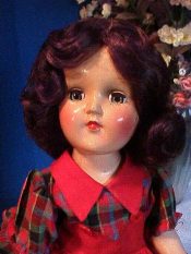 Antique doll with rosy cheeks