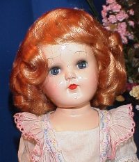 Vintage doll with curly red hair
