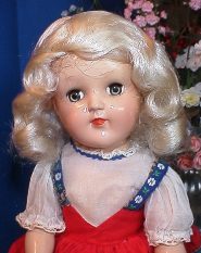 Vintage doll with blonde curls